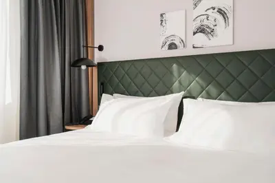Letto o letti in una camera di Hilton Garden Inn Padova City Centre