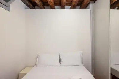 Letto o letti in una camera di GuestHost - Padova - Piazza dei Signori Central Flats