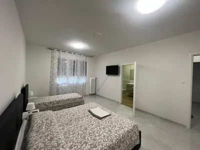 Letto o letti in una camera di Casa Roma rooms&apartments