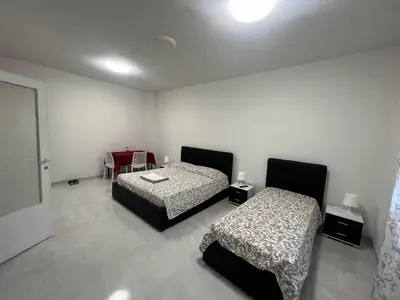 Letto o letti in una camera di Casa Roma rooms&apartments