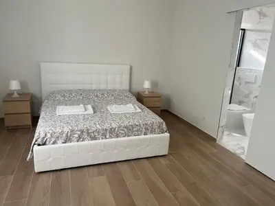 Letto o letti in una camera di Casa Roma rooms&apartments