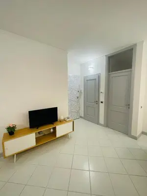 TV o dispositivi per l'intrattenimento presso Amikales Rooms
