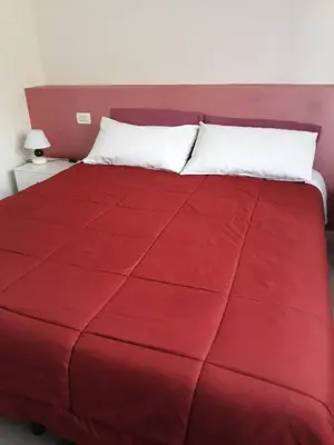 Letto o letti in una camera di B&B A Un Passo Da