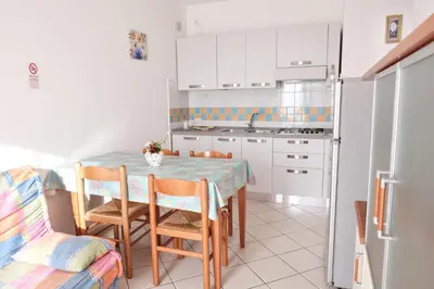 Cucina o angolo cottura di Poolside escape in Rosolina-Beahost