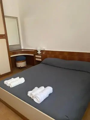 Letto o letti in una camera di B&B Le Rose