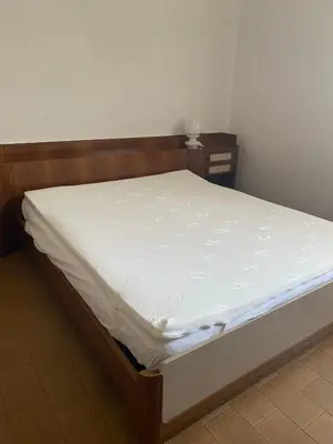 Letto o letti in una camera di B&B Le Rose