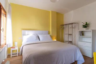 Letto o letti in una camera di Giustiniani Apartments
