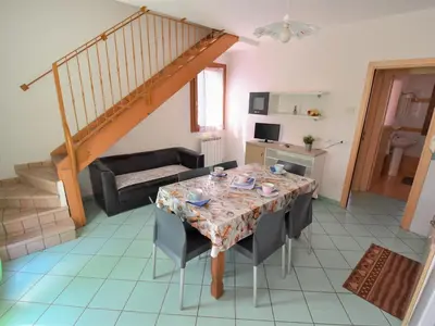 Area soggiorno di Apartment Solmare-29 by Interhome
