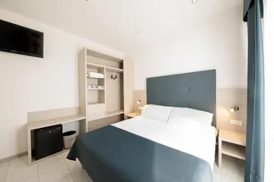 Letto o letti in una camera di Hotel El Salvador Frontemare Piscina Riscaldata