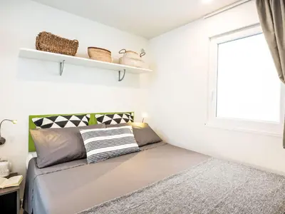 Letto o letti in una camera di Holiday Home Happy Superior by Interhome