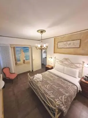 Letto o letti in una camera di Ca'Briani Luxury - Behind S.Mark Square