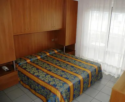 Letto o letti in una camera di Pensione Villa Joli