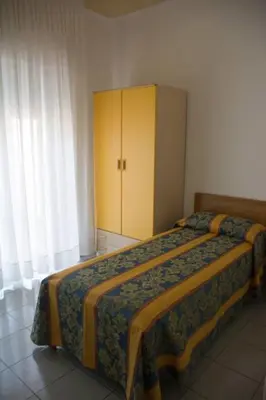 Letto o letti in una camera di Pensione Villa Joli