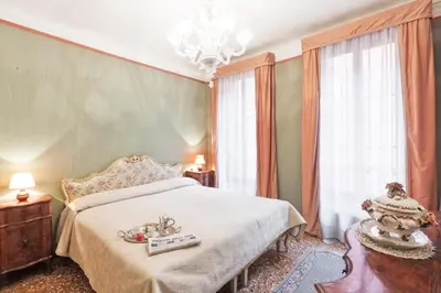 Letto o letti in una camera di Palazzetto San Lio, Rialto