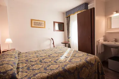 Letto o letti in una camera di Albergo Casa Peron