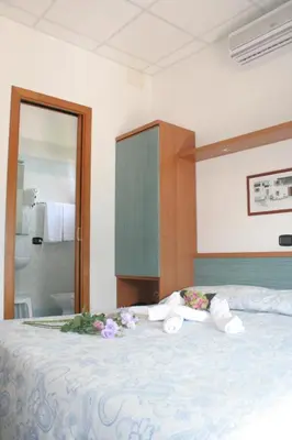 Letto o letti in una camera di Hotel Trifoglio
