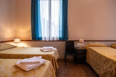 Letto o letti in una camera di Foresteria Valdese Venezia