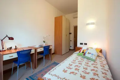Letto o letti in una camera di Casa Battisti
