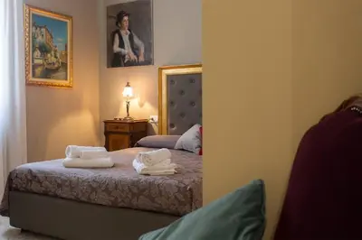 Letto o letti in una camera di San Marco Elegant - vista sul campanile