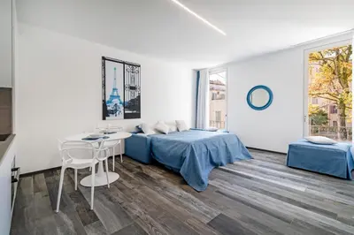 Letto o letti in una camera di Palazzo Ruzante Padova - Parigi Apt