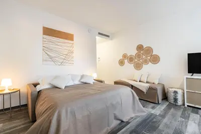 Letto o letti in una camera di Palazzo Ruzante Padova - Atene Apt