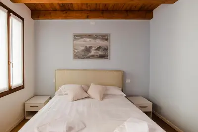 Letto o letti in una camera di Dimora Acquamarina