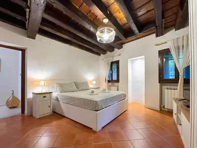 Letto o letti in una camera di Casa Alleria Venezia Cozy Apartment by Rialto Bridge