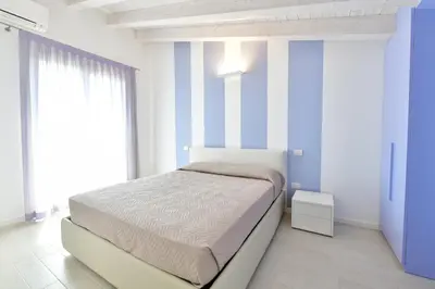 Letto o letti in una camera di Wave Village 2 Apartments