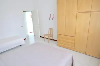 Letto o letti in una camera di Bagni Miramare Apartments