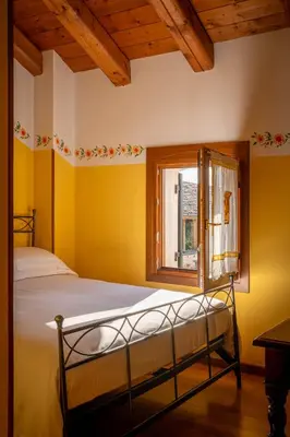 Letto o letti in una camera di Locanda al Convento