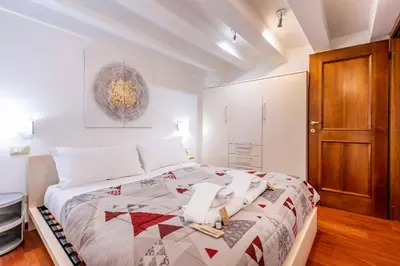 Letto o letti in una camera di Glass House - Loft 2 minutes to Rialto Bridge & View