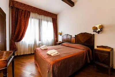 Letto o letti in una camera di Corallo - Piccolo bilocale nel cuore di Venezia