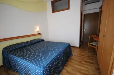 Letto o letti in una camera di Hotel Roma