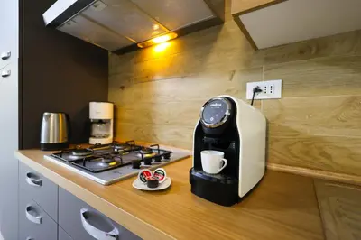 Cucina o angolo cottura di RESIDENCE LA TORRE appartamento FLOWER free parking