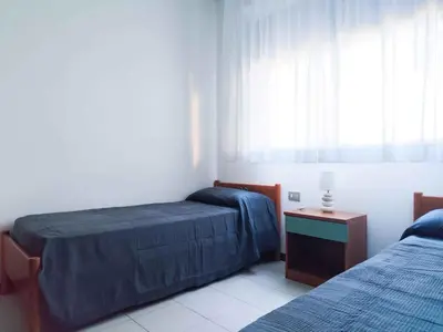 Letto o letti in una camera di Apartments in Lido di Jesolo 25361