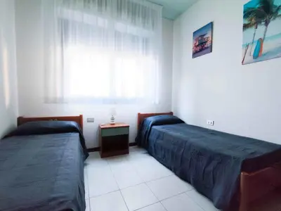 Letto o letti in una camera di Apartments in Lido di Jesolo 25361