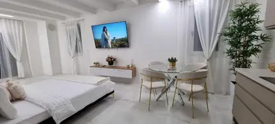 TV o dispositivi per l'intrattenimento presso CasaKadd001Luxury Heated Pool Garden PatioBarbeque