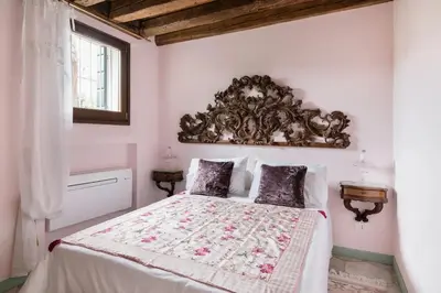 Letto o letti in una camera di Biennale, Corte dell' Angelo, una casa romantica