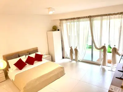 Letto o letti in una camera di GINNY HOUSE VENEZIA - appartamento moderno open Space vicino Venezia e Padova