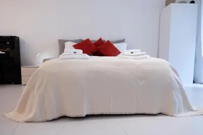 Letto o letti in una camera di GINNY HOUSE VENEZIA - appartamento moderno open Space vicino Venezia e Padova