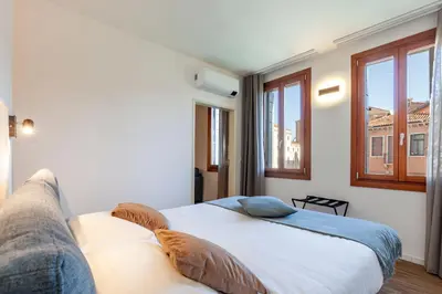 Letto o letti in una camera di SAN LORENZO APARTMENTS 5054