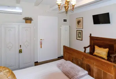 Letto o letti in una camera di i Torretti Locazione Turistica, Ristorante, Lounge Bar