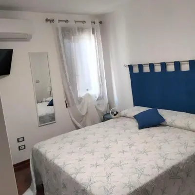 Letto o letti in una camera di Casa del Capitano