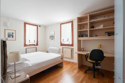 Letto o letti in una camera di Ca' Coriandolo