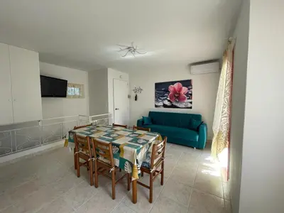 TV o dispositivi per l'intrattenimento presso Spacious apartment with terrace in Rosolina Mare
