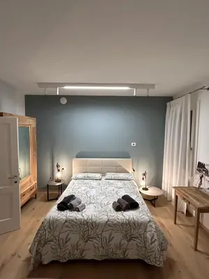 Letto o letti in una camera di AMIA rooms & wine
