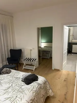 Letto o letti in una camera di AMIA rooms & wine