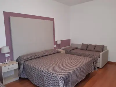 Letto o letti in una camera di Hotel Telenia
