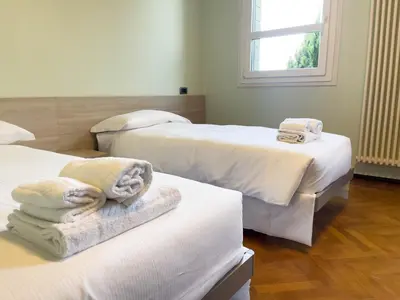 Letto o letti in una camera di Spazioso Apt vicino Stazione - Posto Auto