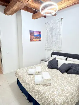 Letto o letti in una camera di Ca' Spritz - Home